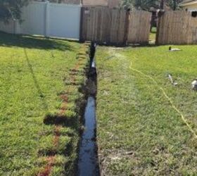 how to stop water runoff from a neighbor s yard