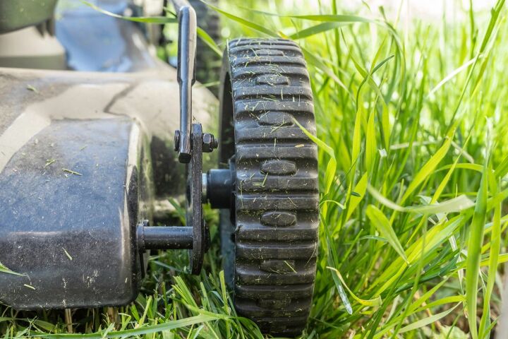 should mower deck wheels touch the ground
