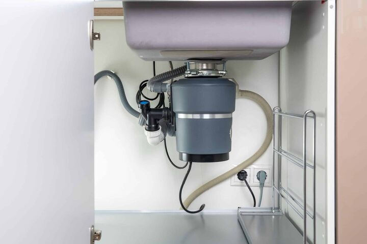 garbage disposal spits up in the other side of the sink