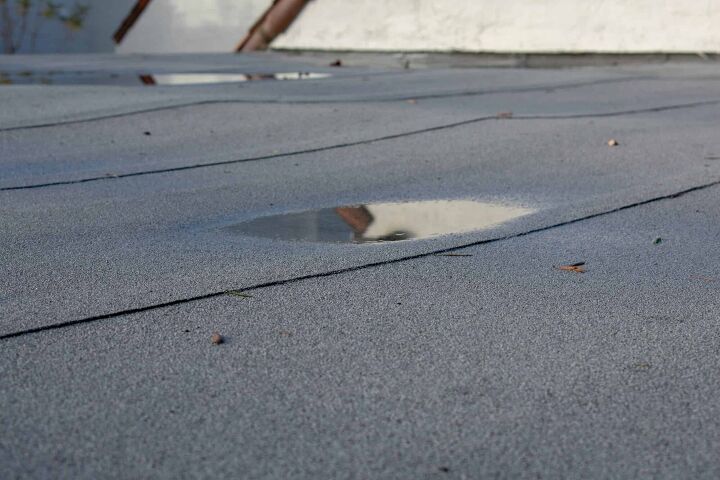 Flat Roof Leaks In Heavy Rain? (Possible Causes & Fixes)