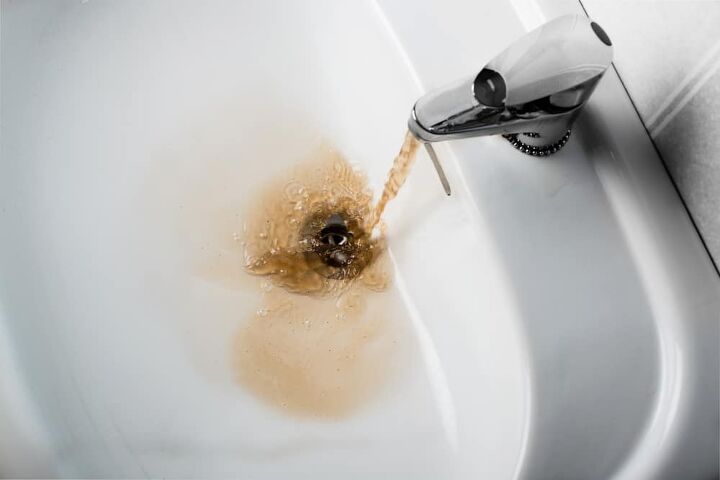 burst of black water from faucet possible causes fixes