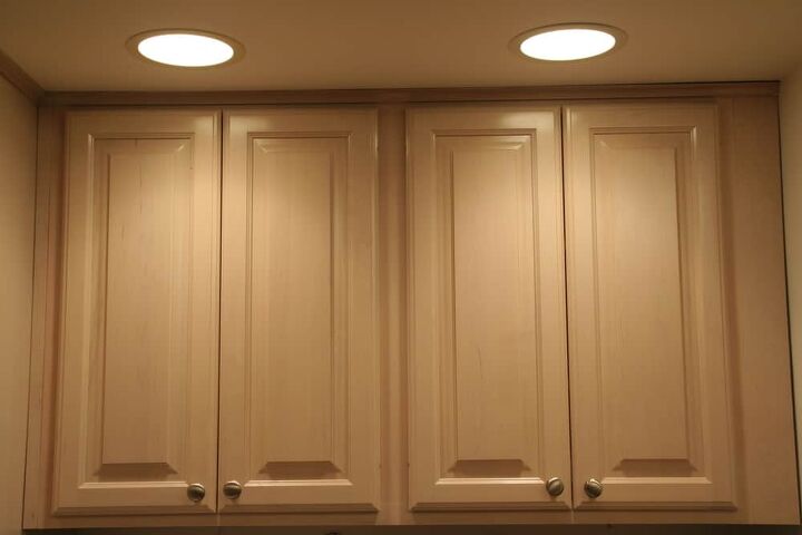 how far should recessed lights be from a cabinet