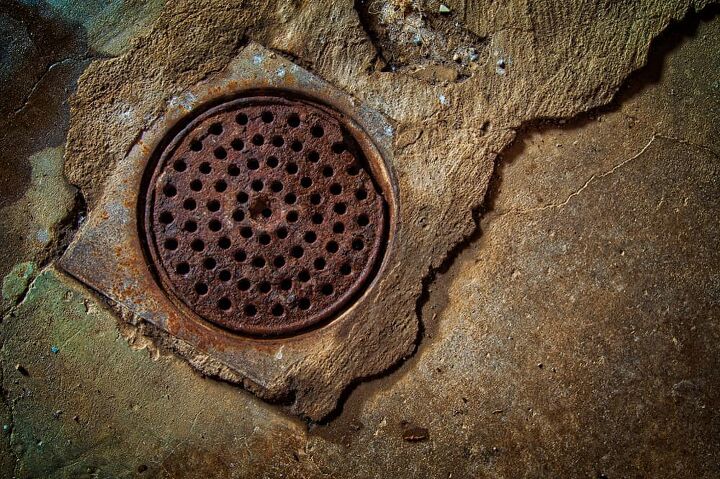 Basement Floor Drain Backs Up When Toilet is Flushed? (Fix It Now)