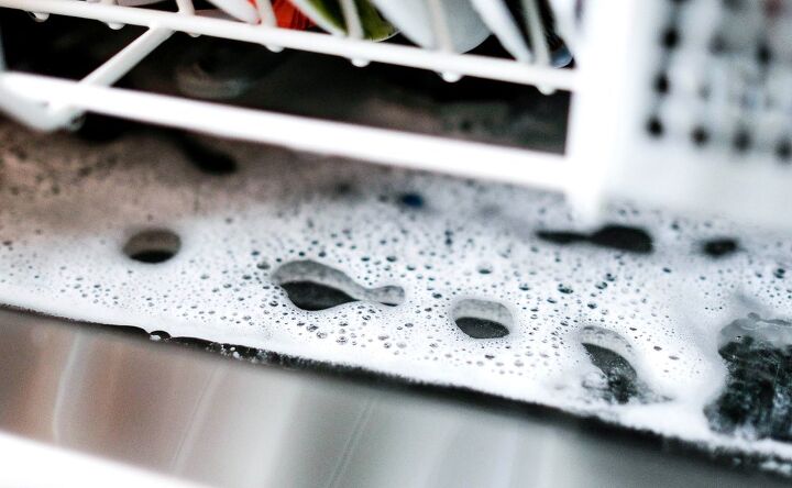 dishwasher filling with water but not spraying possible causes fixes