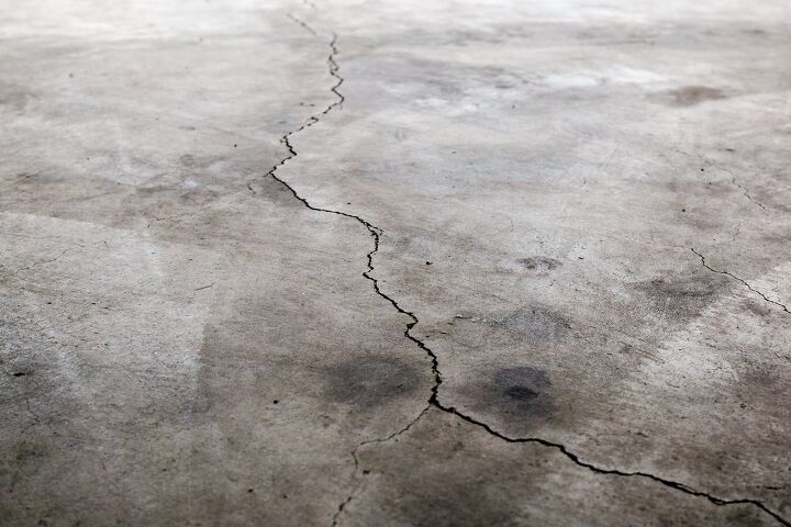 garage floor cracked and is sinking here s what you can do