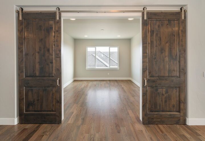 can you hang a barn door from the ceiling find out now
