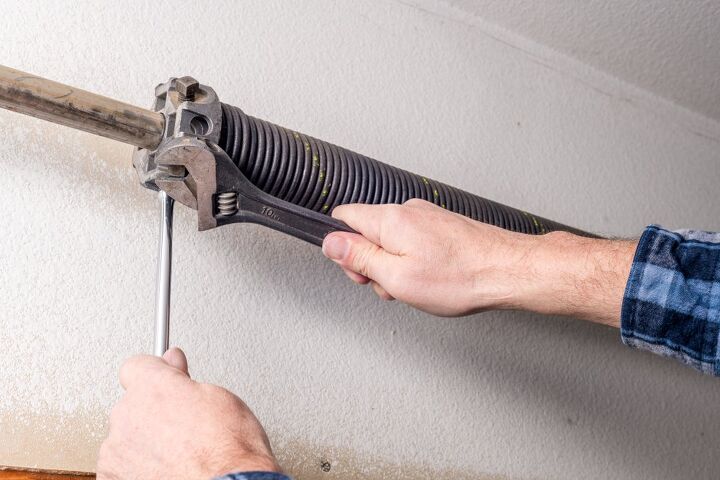 how do you know if your garage door spring is broken