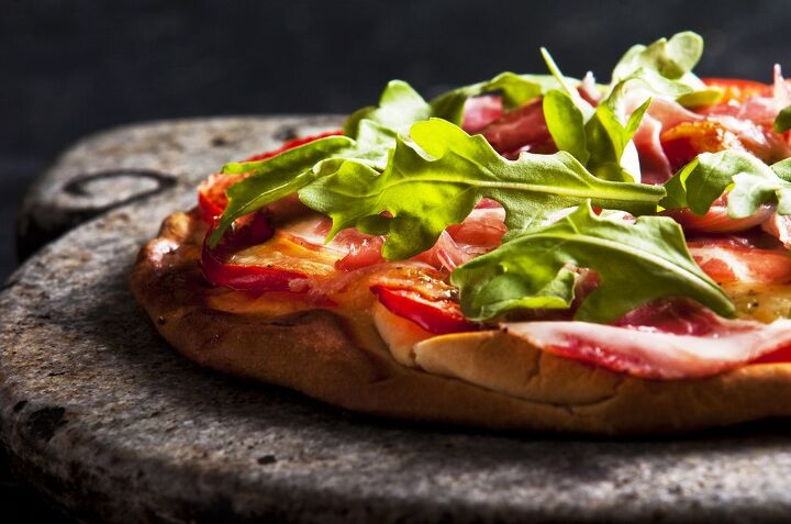 How To Use A Pizza Stone, And Why Your Kitchen Needs One
